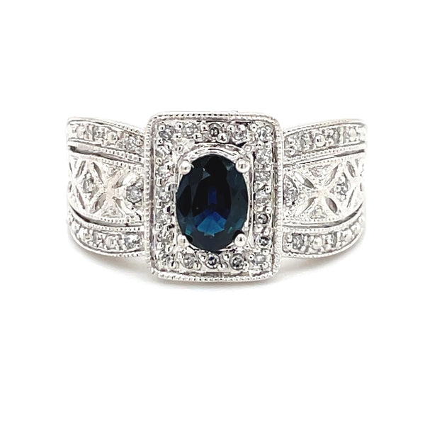 ESTATE 14K WHITE GOLD REGAL RING FEATURING OVAL BLUE SAPPHIRE WITH DIAMOND ACCENTS