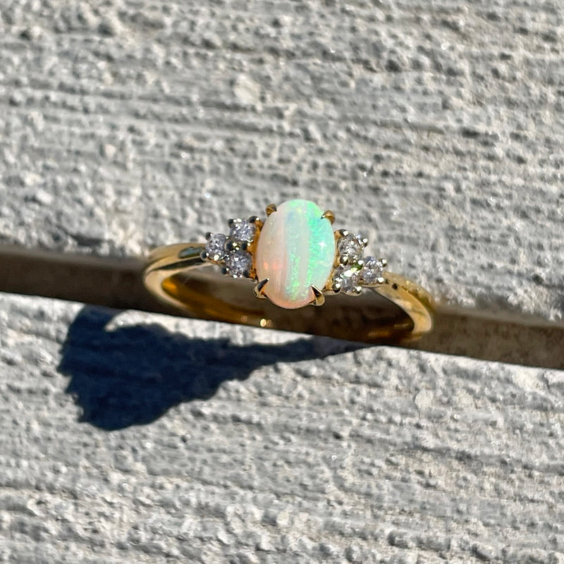 14K Yellow Gold .51ct Oval Opal Ring with .15ctw Diamond Cluster Accents