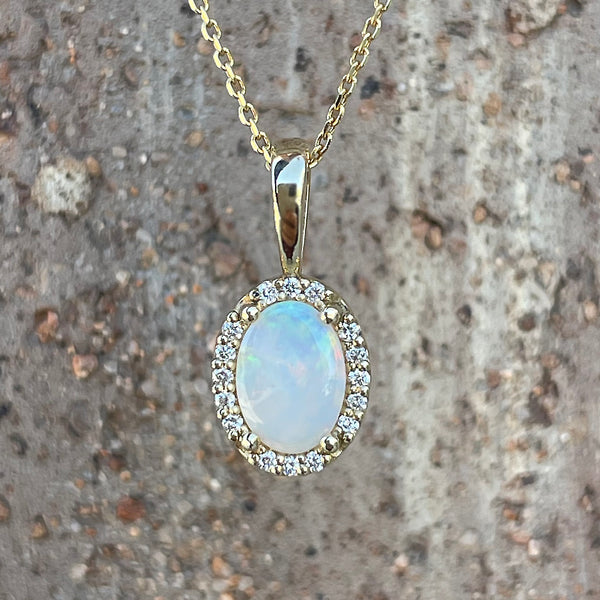14K Yellow Gold .30ct Oval Opal Halo Pendant with Diamond Accents on 18" Cable Chain