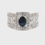 ESTATE 14K WHITE GOLD REGAL RING FEATURING OVAL BLUE SAPPHIRE WITH DIAMOND ACCENTS